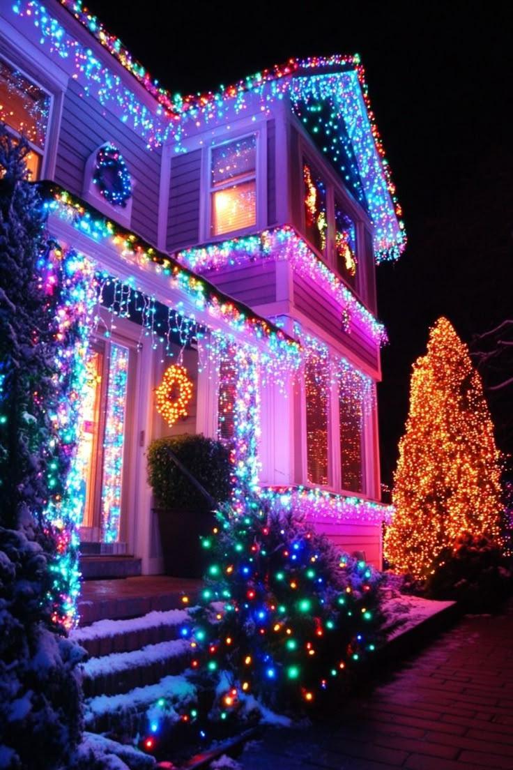 Multicolor residential Christmas lights with icicles and snow